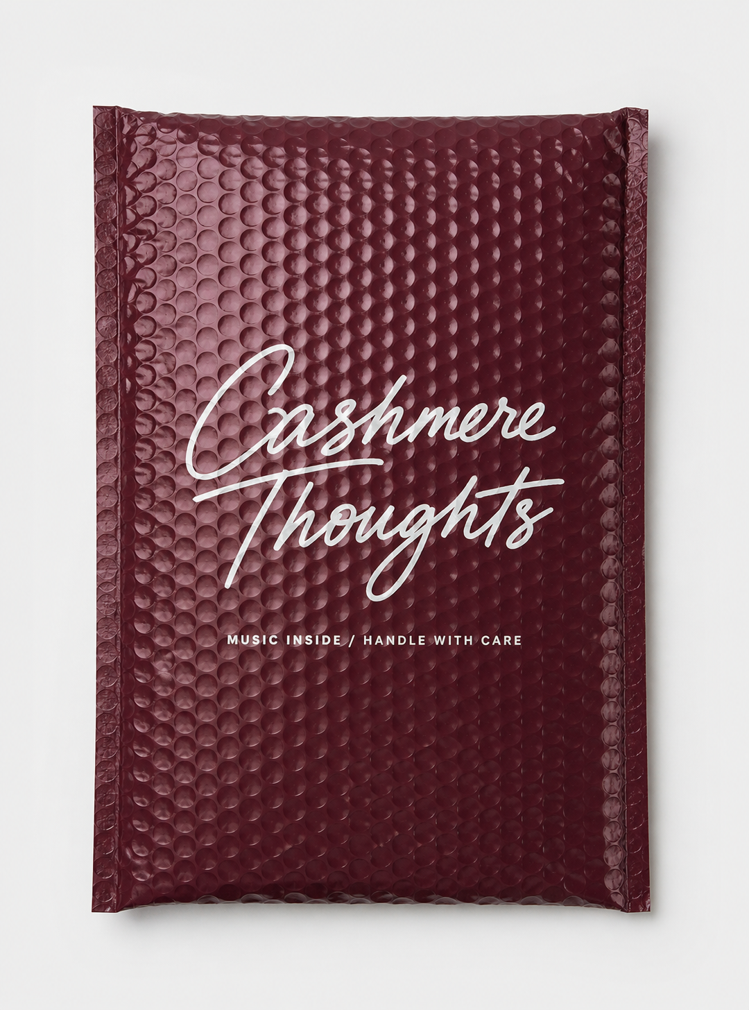 Sticker Mule custom bubble mailer with full-bleed Cashmere Thoughts print