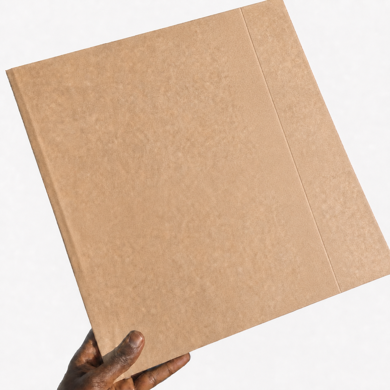 TPC LP Wrap held by a Black hand with a small burgundy Cashmere Thoughts seal across the opening fold